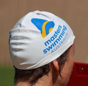 Image of someone wearing a Masters swimming swim cap