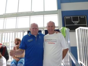This image shows President John Collis (left) models his one million metres polo shirt, while Ross Burden (right) advertises the MS 24 hour Mega Swim